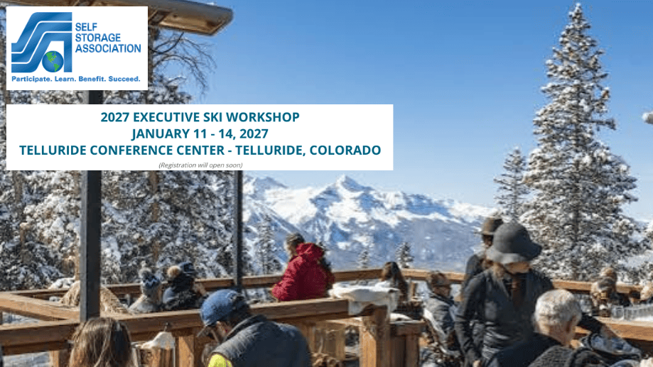 People in winter clothing gather on a snowy outdoor deck with mountains in the background. Banner shows details for a 2027 Self Storage Association ski workshop in Telluride, Colorado.